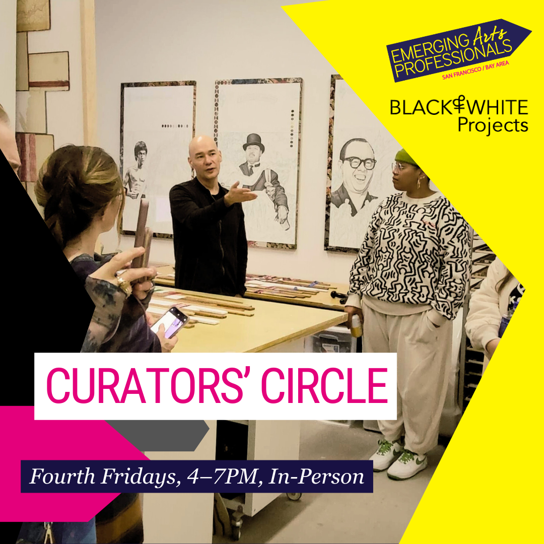 Image of three people talking in an artist studio with large-scale drawings on the wall.