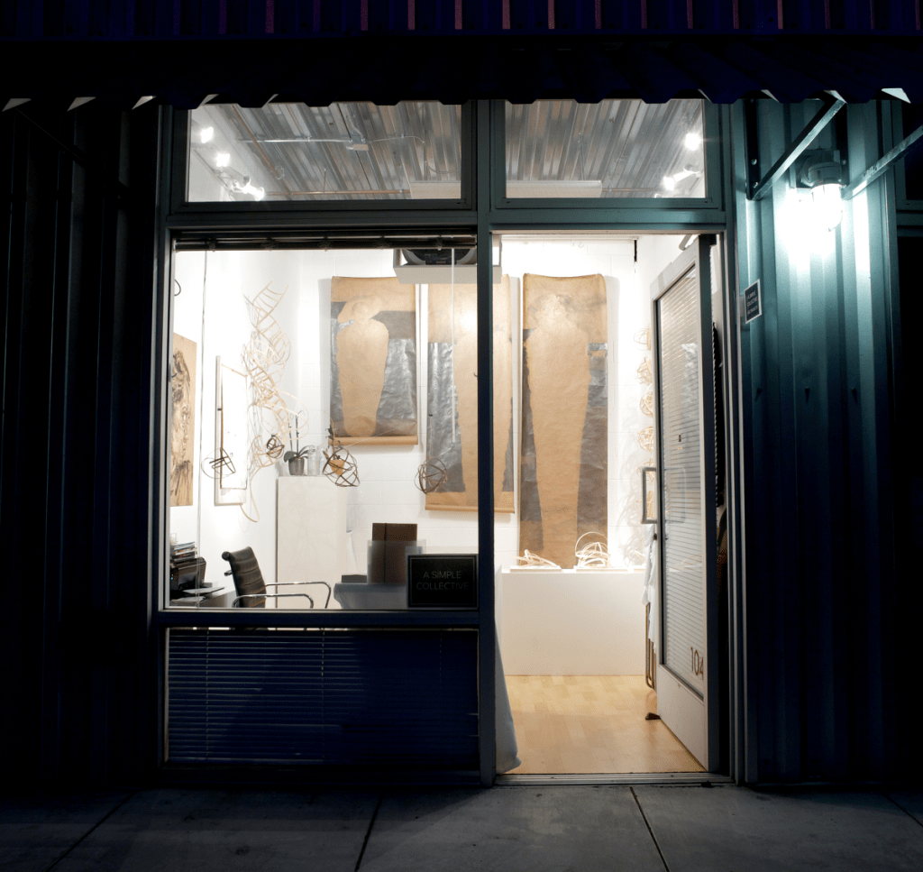 View of gallery through the storefront windows from the street